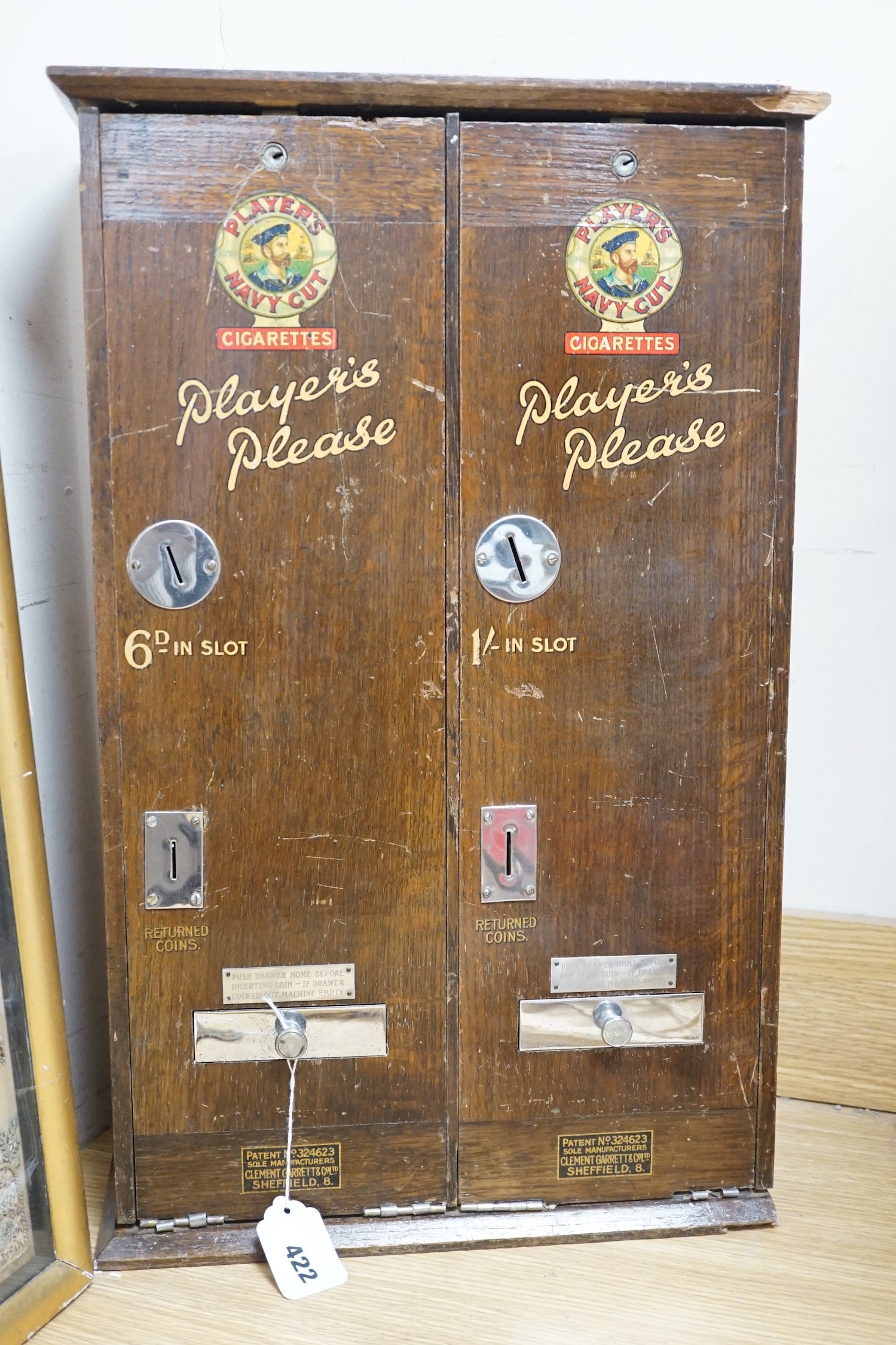 A ‘Players Please’ cigarette vending machine, 60cms x 38cms